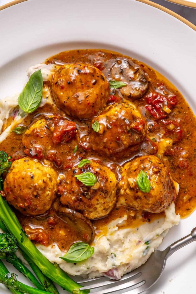 tight shot of Healthy dinner spread featuring marry me chicken meatballs