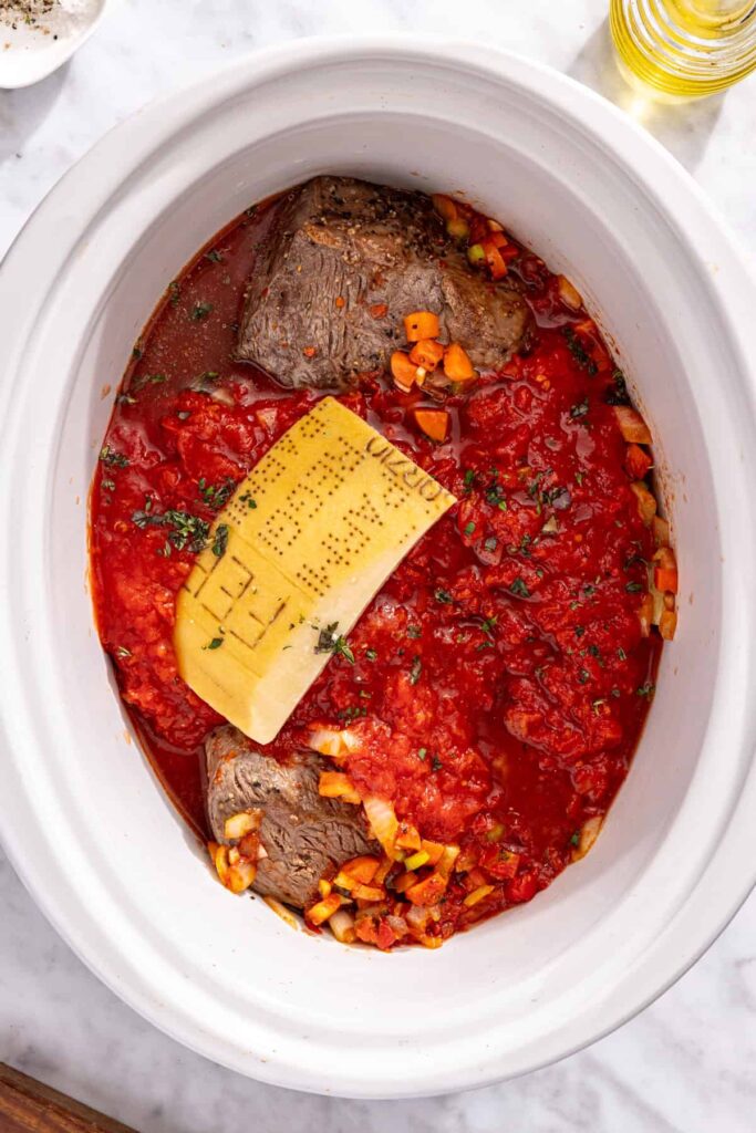 Ingredients added to slow cooker for short rib ragu before cooking
