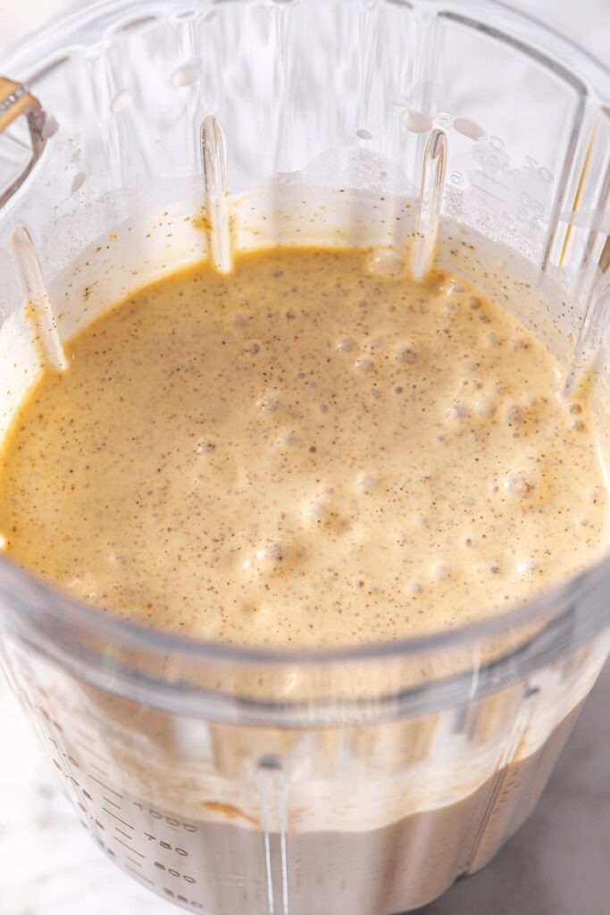 Close-up of blended chocolate coconut smoothie in blender