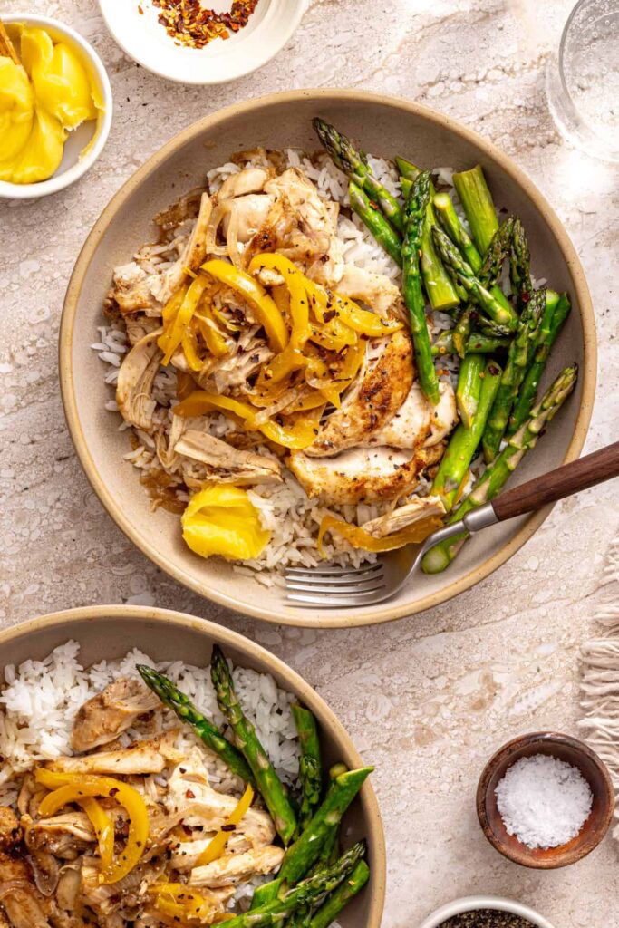 Healthy rice bowls with chicken and vegetables styled tabletop