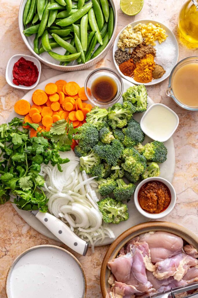 ingredients for slow cooker chicken curry laid out on table