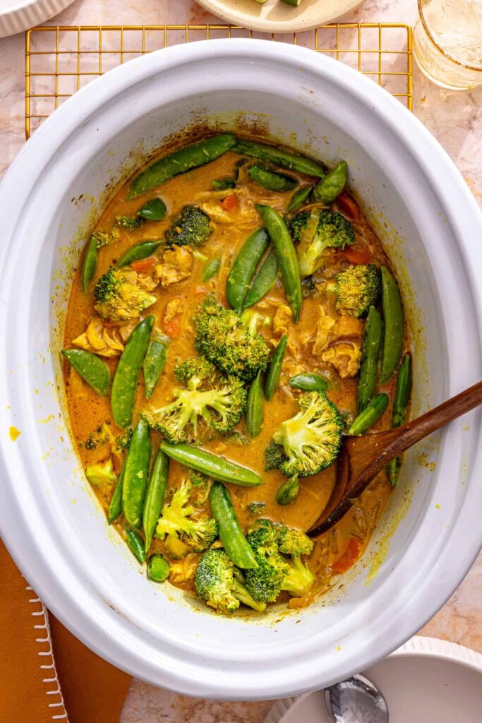 fresh vegetables stirred into crockpot chicken curry