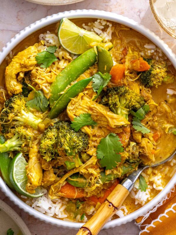 crockpot chicken curry over basmati rice, close-up overhead shot with spoon