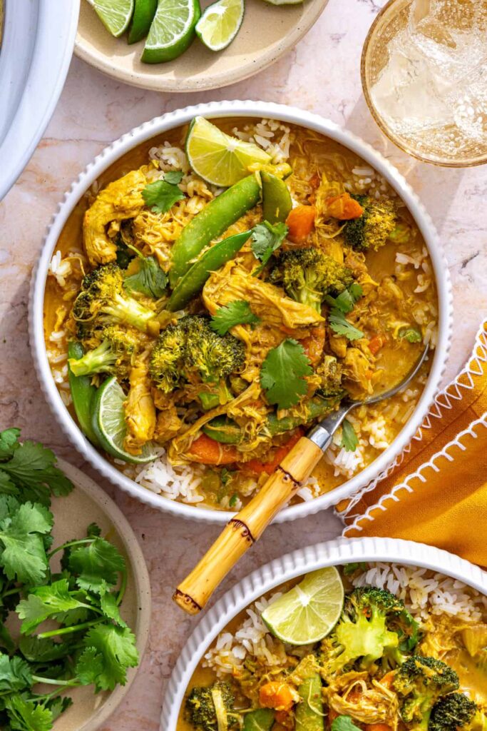 healthy chicken curry over rice in bowl, overhead view