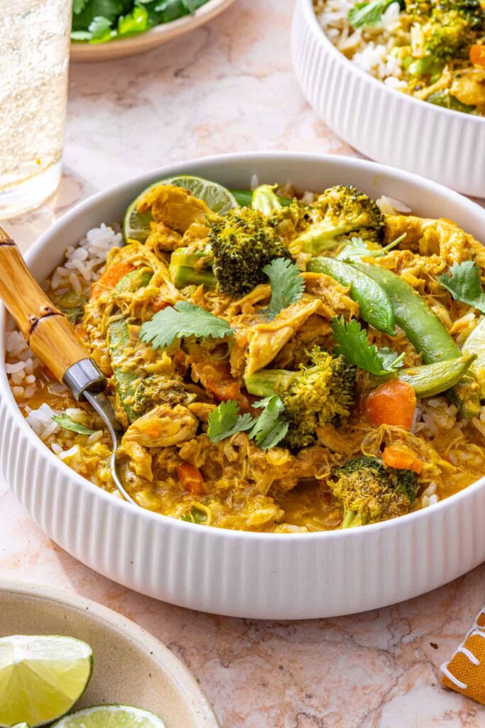 close-up of creamy slow cooker chicken curry sauce and rice