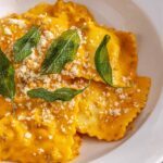 High-protein butternut squash ravioli with ground beef and crispy sage