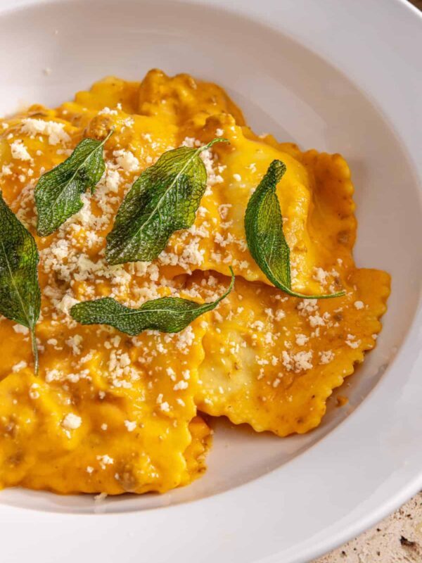 High-protein butternut squash ravioli with ground beef and crispy sage