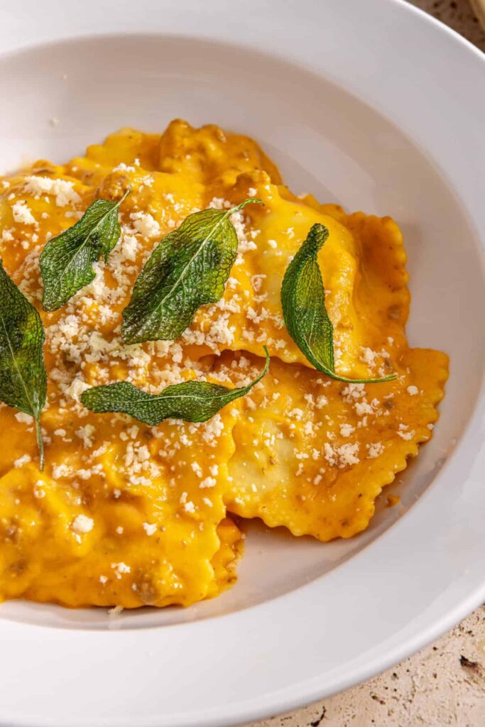 High-protein butternut squash ravioli with ground beef and crispy sage