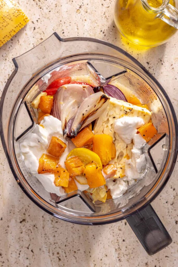 Hidden veggie ravioli sauce in blender with broth and coconut cream