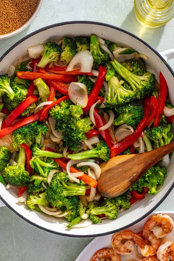 Stir frying fresh vegetables until tender-crisp in pan