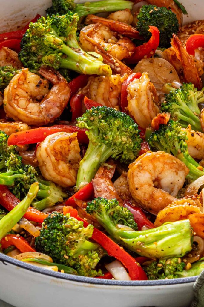 Close-up of shrimp stir fry showing sauce-coated shrimp and vegetables