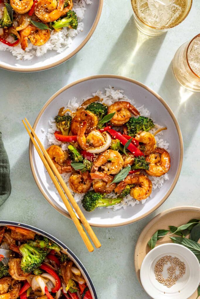 overhead view of styled table with easy shrimp stir fry and chopsticks