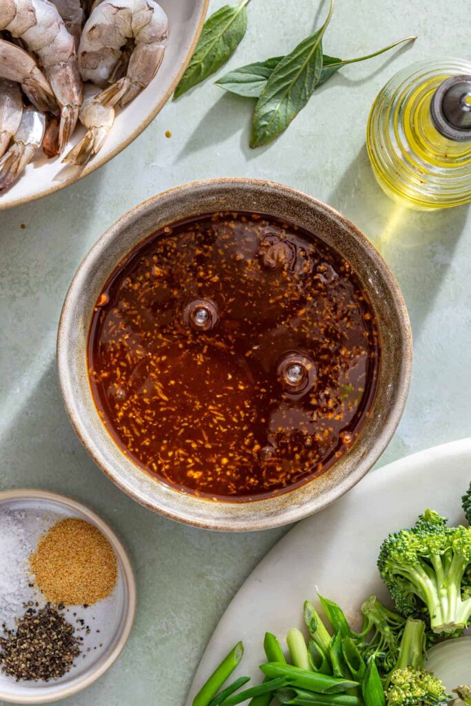 process shot of homemade sauce coming together in a small bowl for stir fry