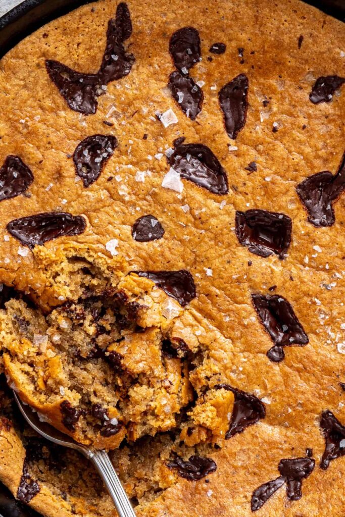 zoomed in shot of gluten-free, dairy-free, gooey and warm chocolate chip skillet cookie