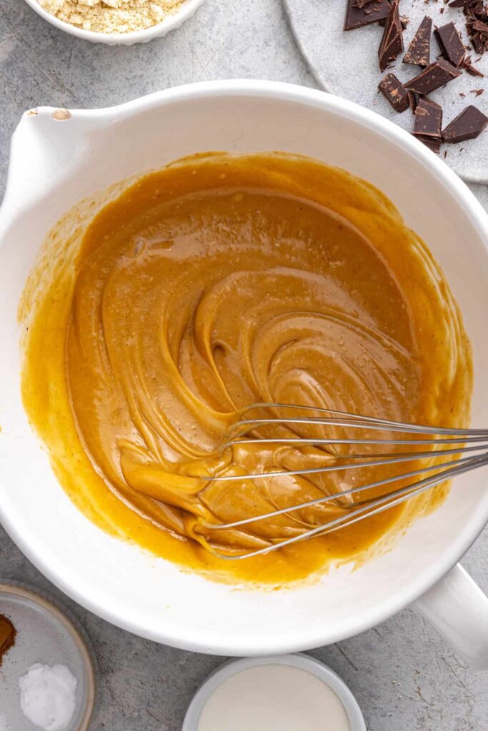 Mixing the wet ingredients for a healthy chocolate chip cookie skillet recipe