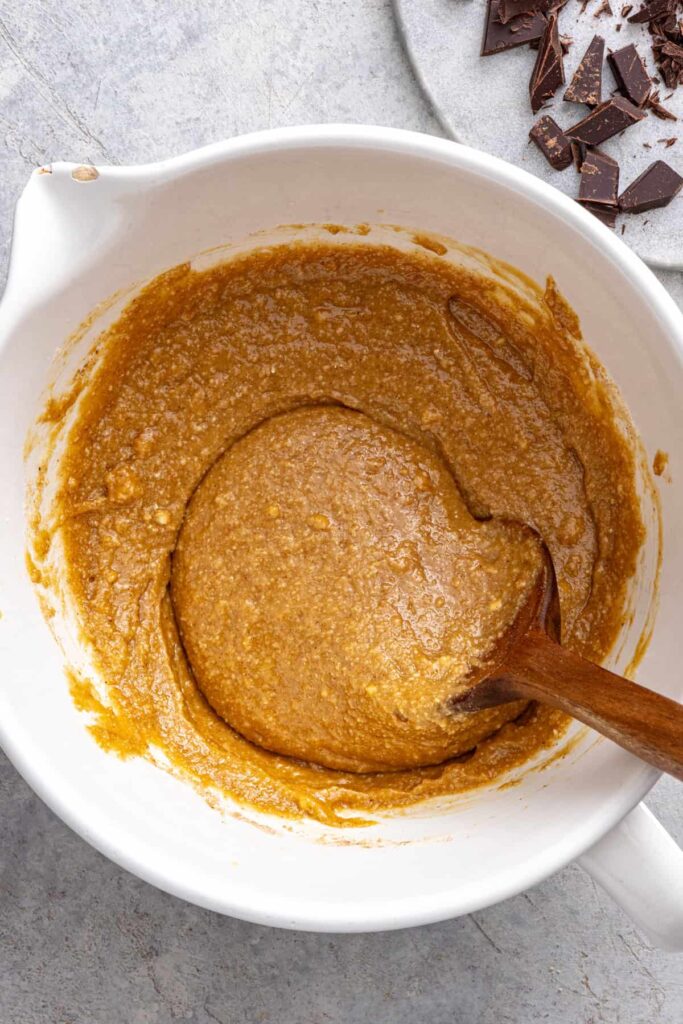 Folding dry ingredients into gluten-free chocolate chip cookie batter