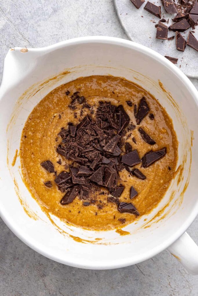 Chocolate chips folded into cookie skillet dough
