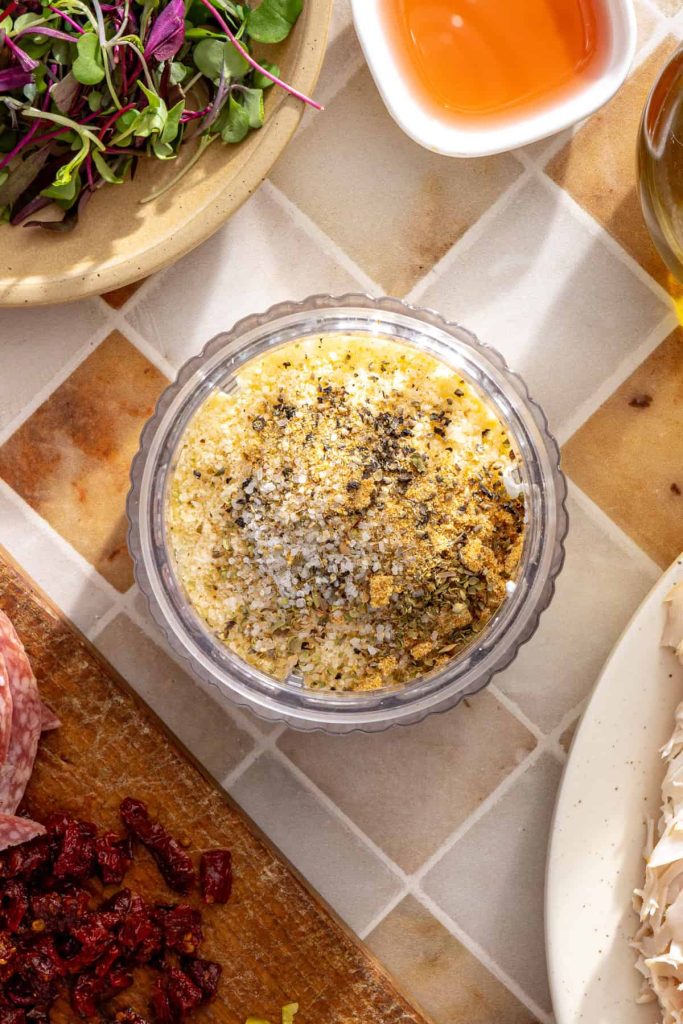 Ingredients for cacio e pepe cottage cheese spread in a blender