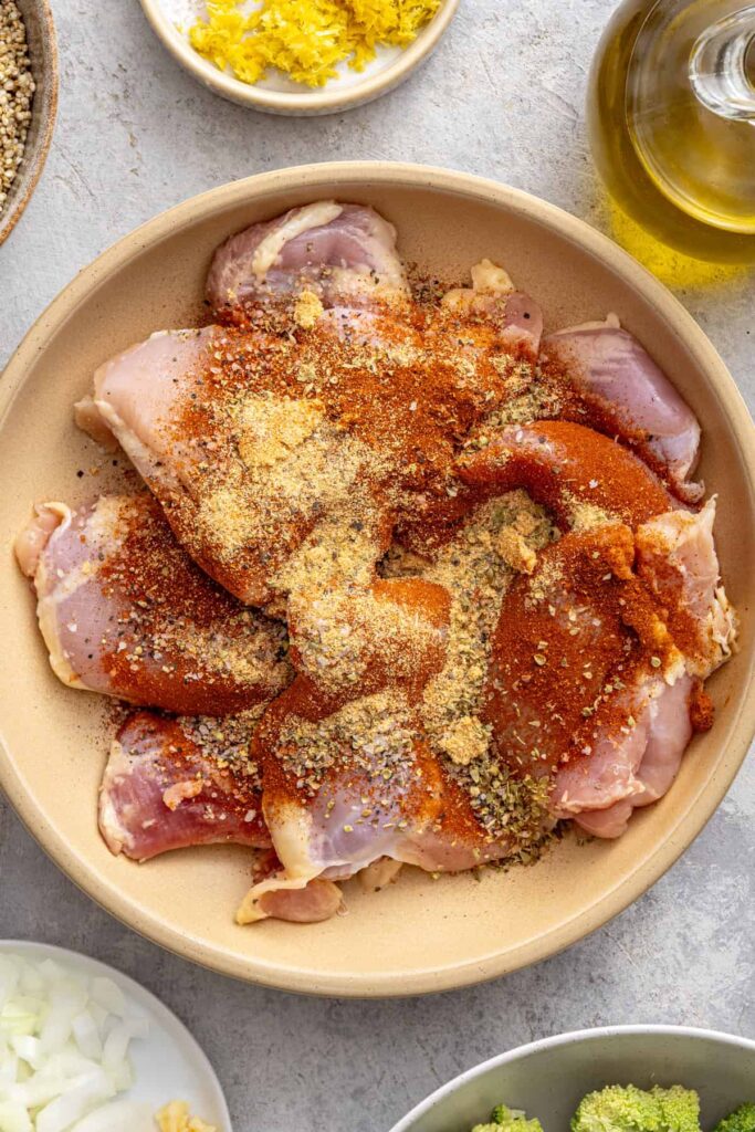 Chicken thighs seasoned with smoked paprika, oregano, garlic powder, salt, and pepper