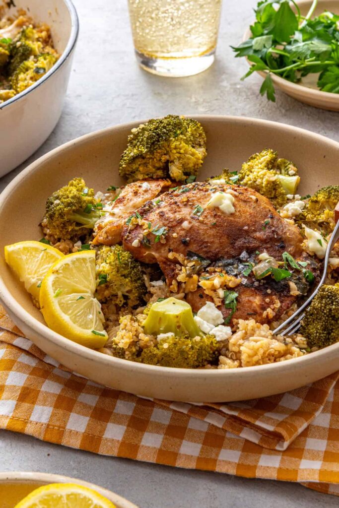 Side angle of chicken quinoa pilaf in a shallow serving bowl