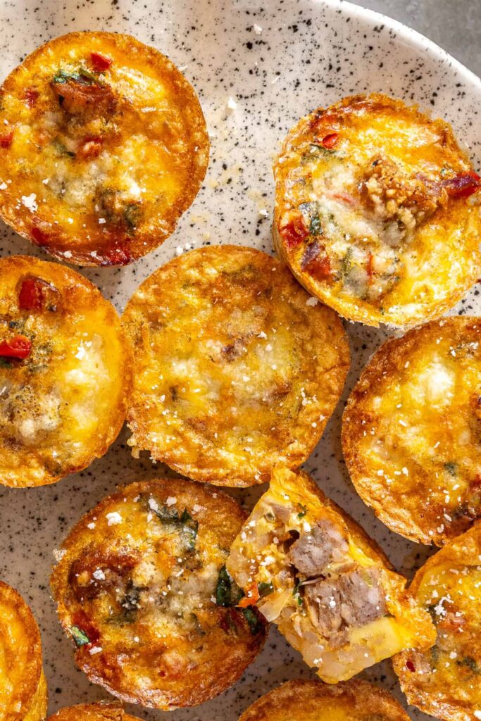 Close-up overhead view of gluten-free quiche cups on cake stand