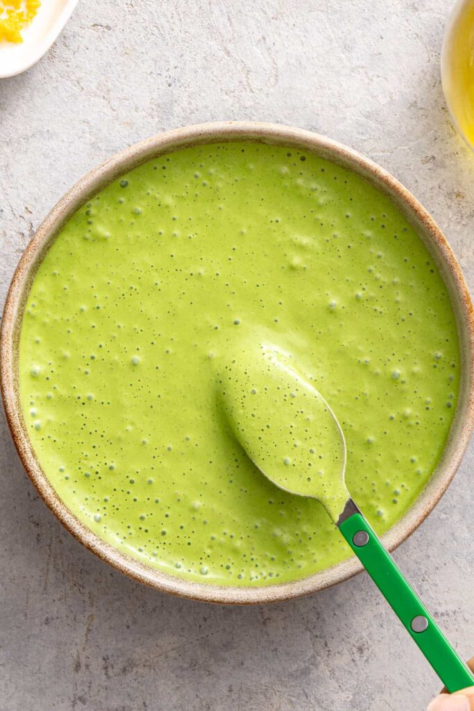 Homemade herb sauce for baked salmon and asparagus