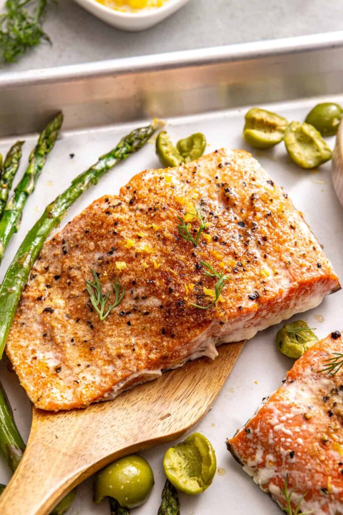 One-pan salmon and asparagus dinner with yogurt herb sauce
