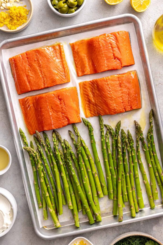 Wild salmon and asparagus prepared for oven baking