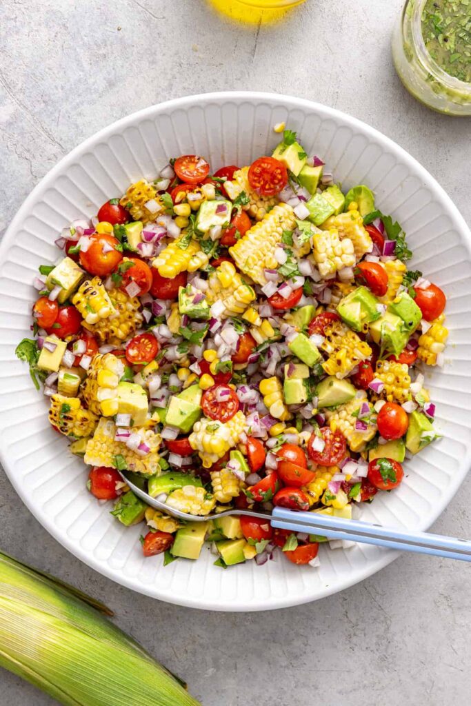 Fresh ingredients combined for corn and tomato summer salad