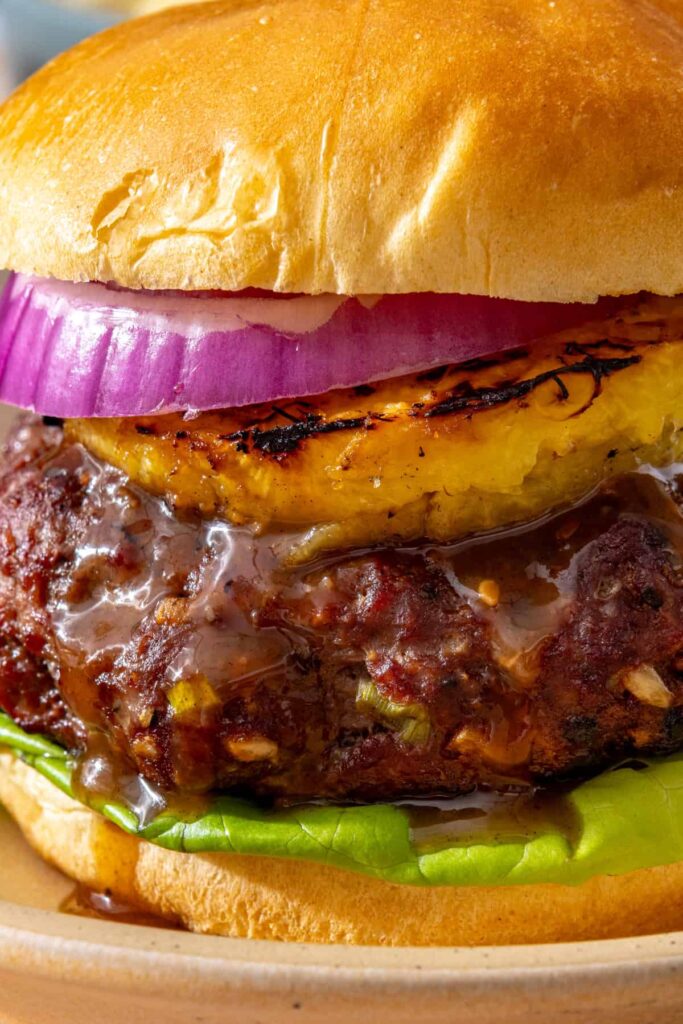 Close-up of homemade teriyaki burger showing the burger layers