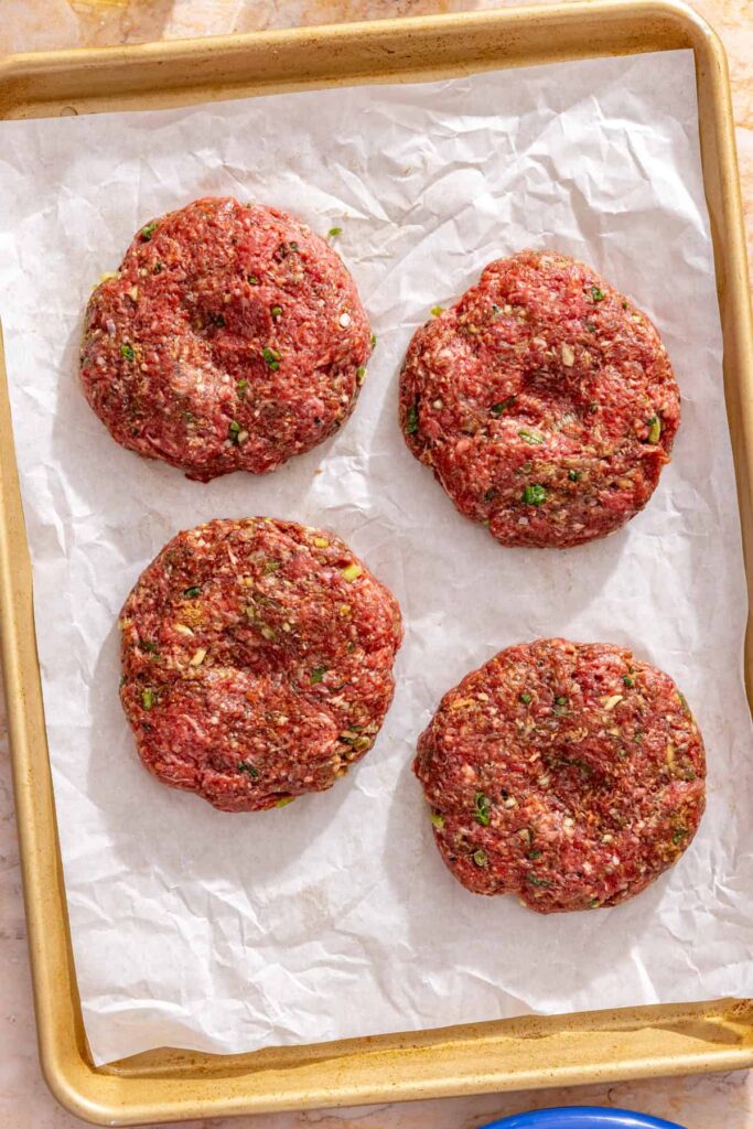 Preparing juicy burger patties with thumbprint centers