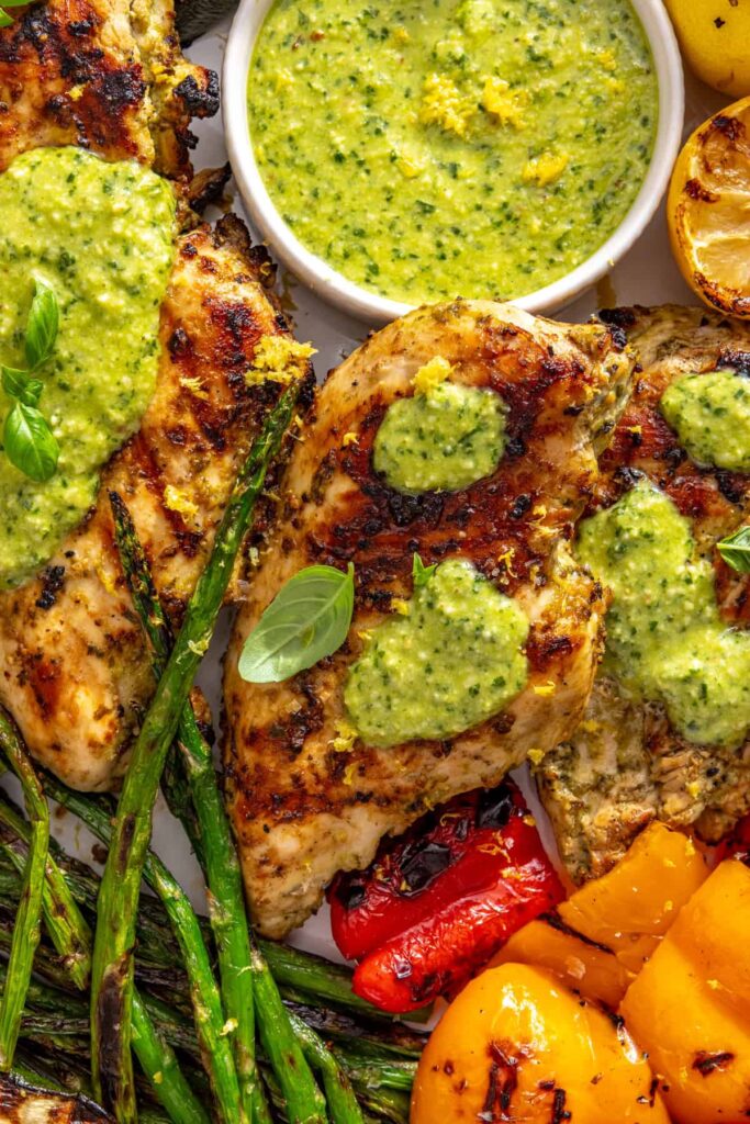 tight shot of healthy lemon pesto grilled chicken and vegetables