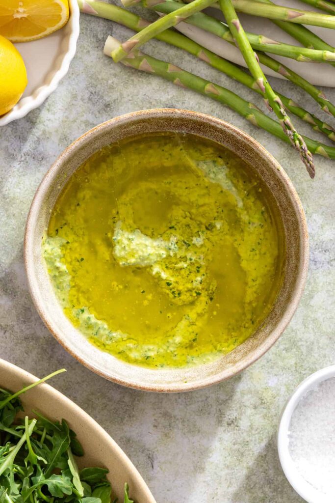 Lemon pesto marinade being mixed for grilled chicken