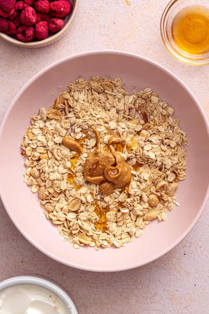 Peanut butter oat crumble coming together in a bowl