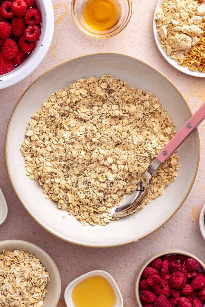 Mixing oats, chia seeds, and powdered peanut butter