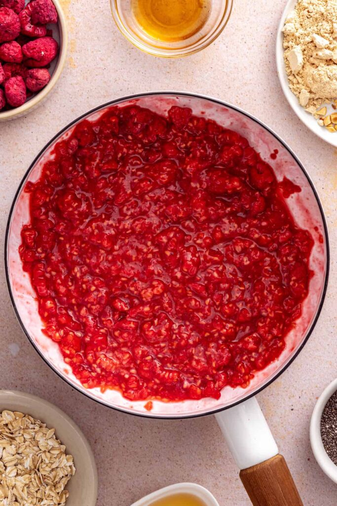 Raspberries simmering to make the jam for peanut butter and jelly overnight oats