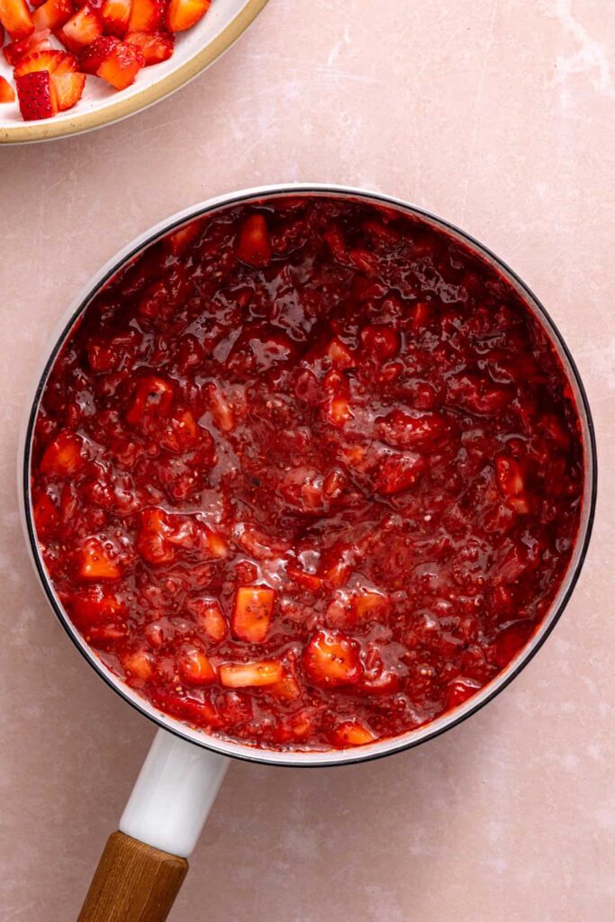 Thick homemade strawberry chia jam filling for strawberry oatmeal bars.