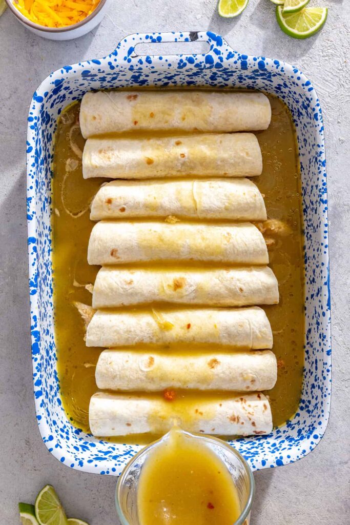 Assembled chicken enchiladas with salsa verde