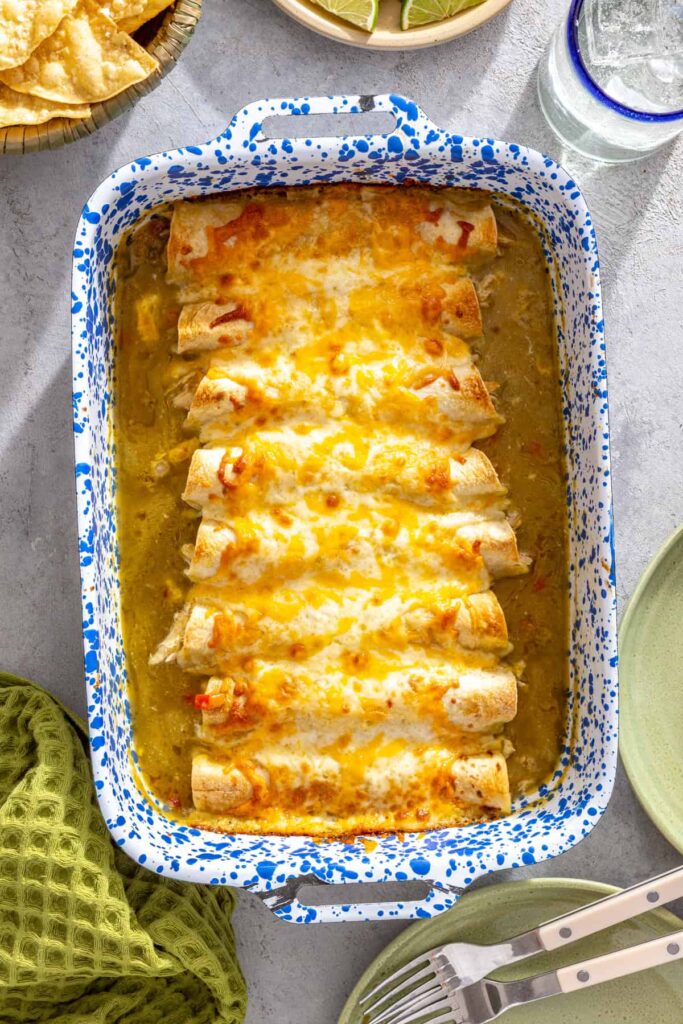 reshly baked creamy green chicken enchiladas with golden melted cheese