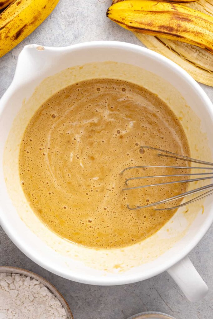 Mixing coconut oil into homemade banana birthday cake batter