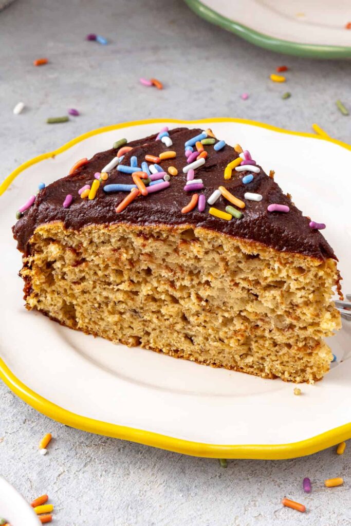 Healthy banana birthday cake slice on dessert plate