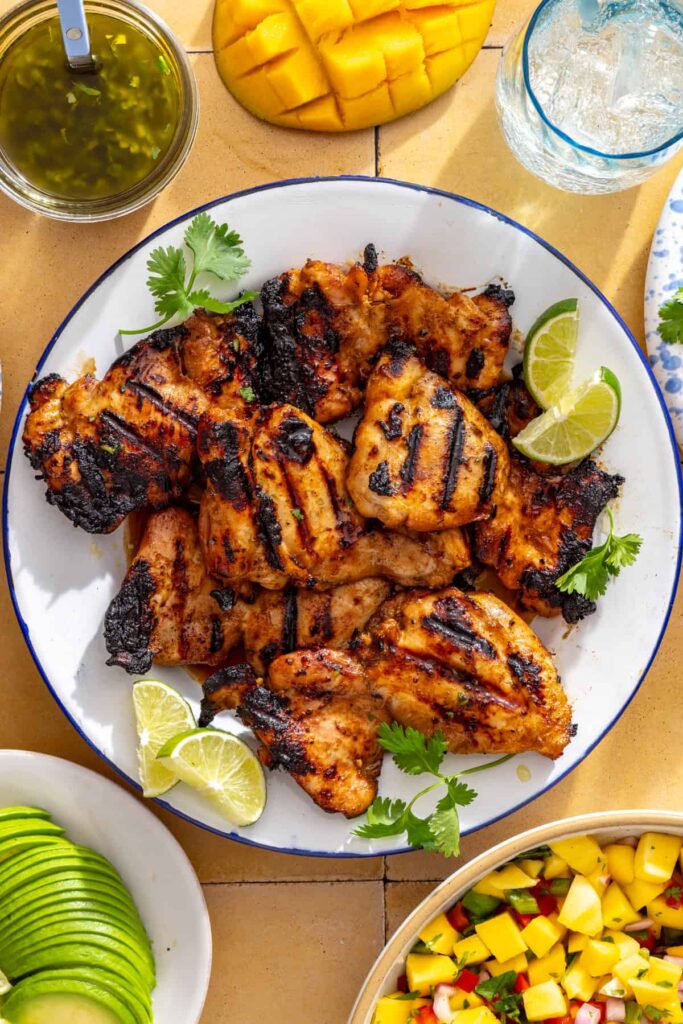 Grilled chicken thighs with charred grill marks
