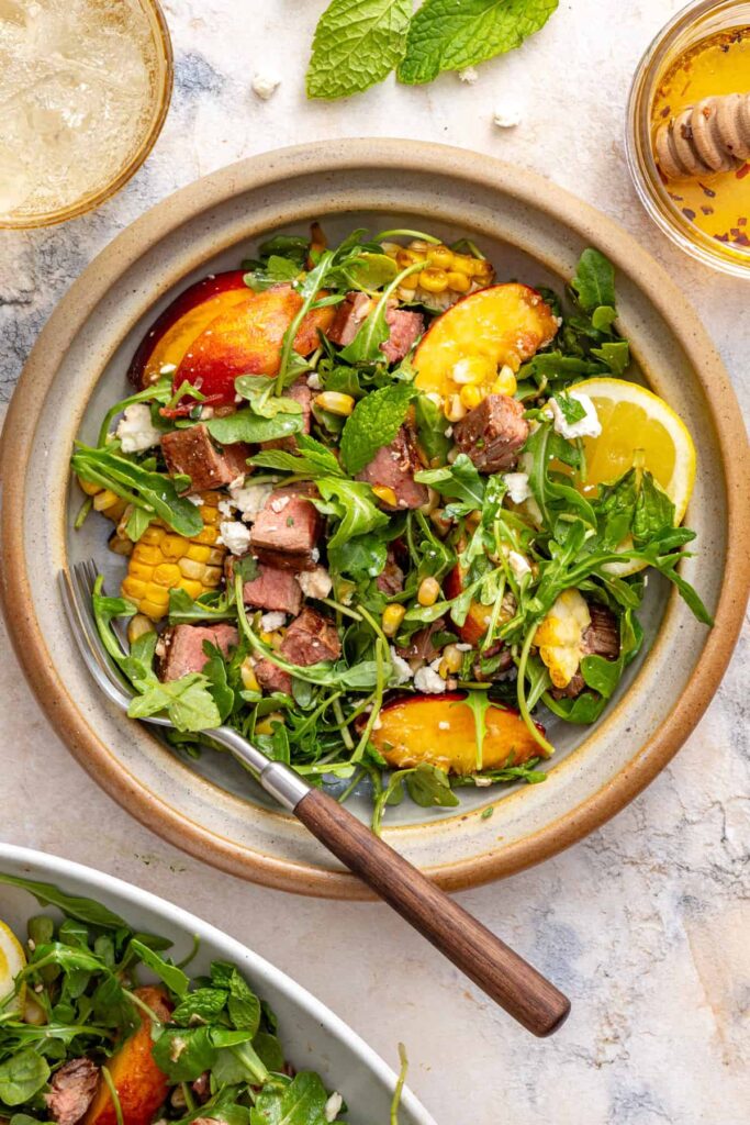 Individual portion of high-protein steak salad ready to enjoy