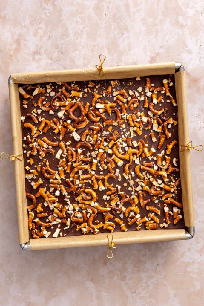 Pretzel topping added to frozen peanut butter pretzel bars.