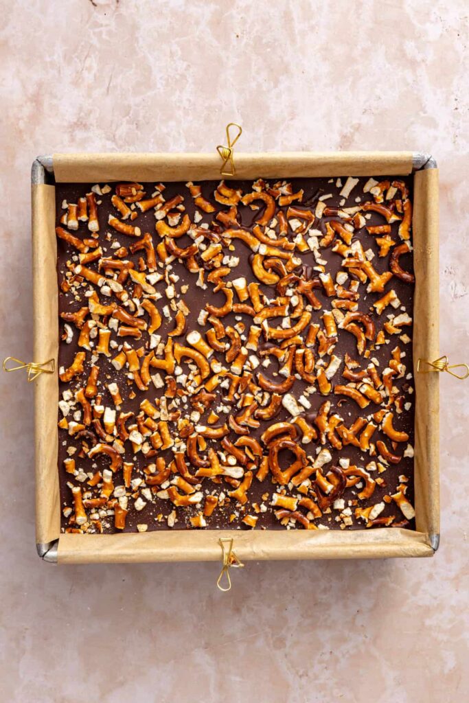 Frozen peanut butter pretzel dessert chilled and ready to slice.