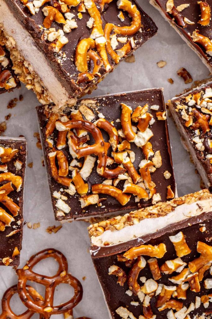close-up overhead shot of high-protein frozen peanut butter bars served with gluten-free pretzels.