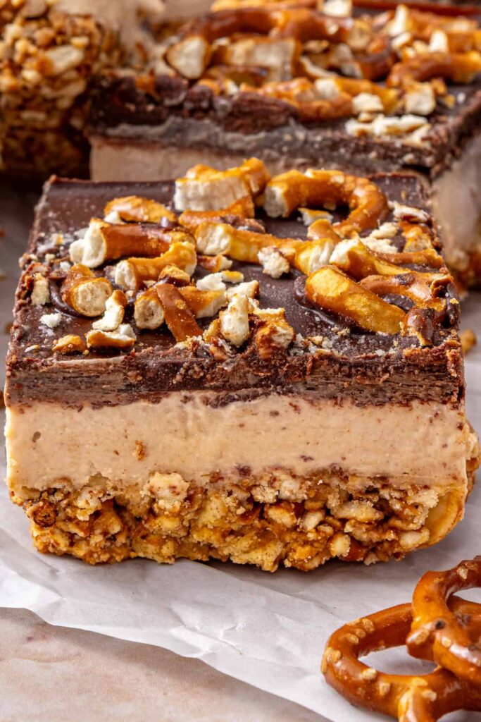 Close-up of one peanut butter pretzel frozen bar showing the layered texture.