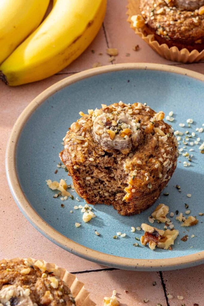 Toddler banana muffin with a bite taken out showing the soft fluffy interior