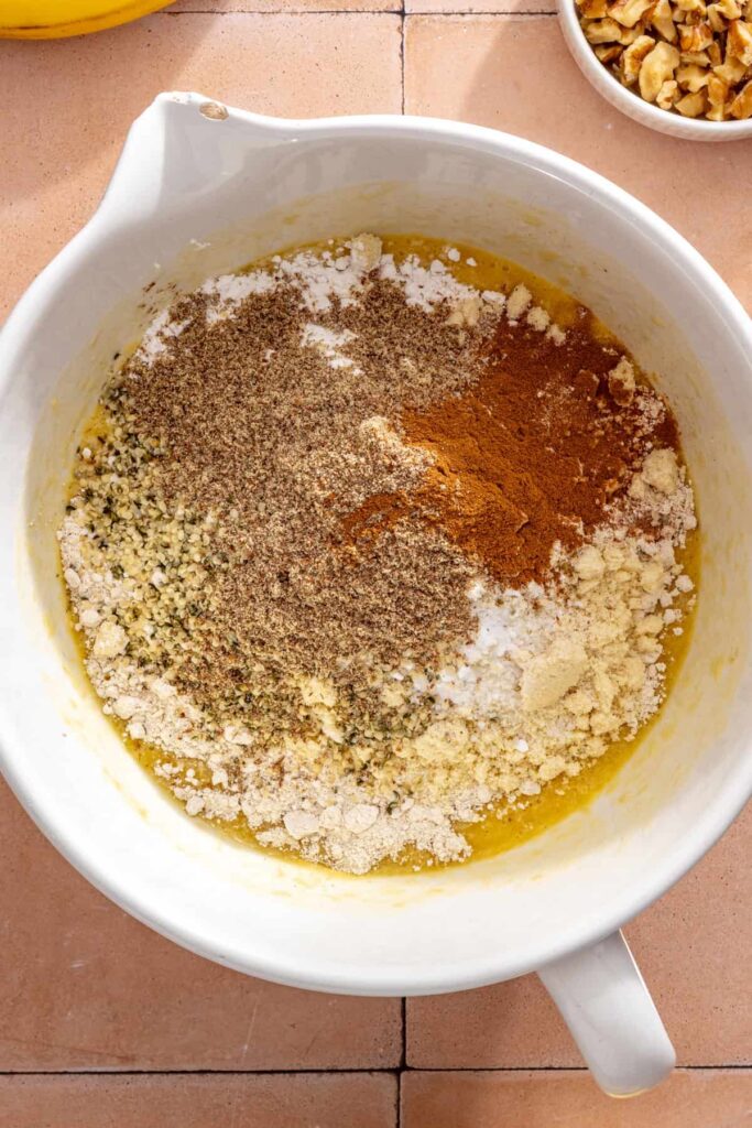 Oat flour, almond flour, flaxseed, hemp seeds, and cinnamon added to banana muffin batter