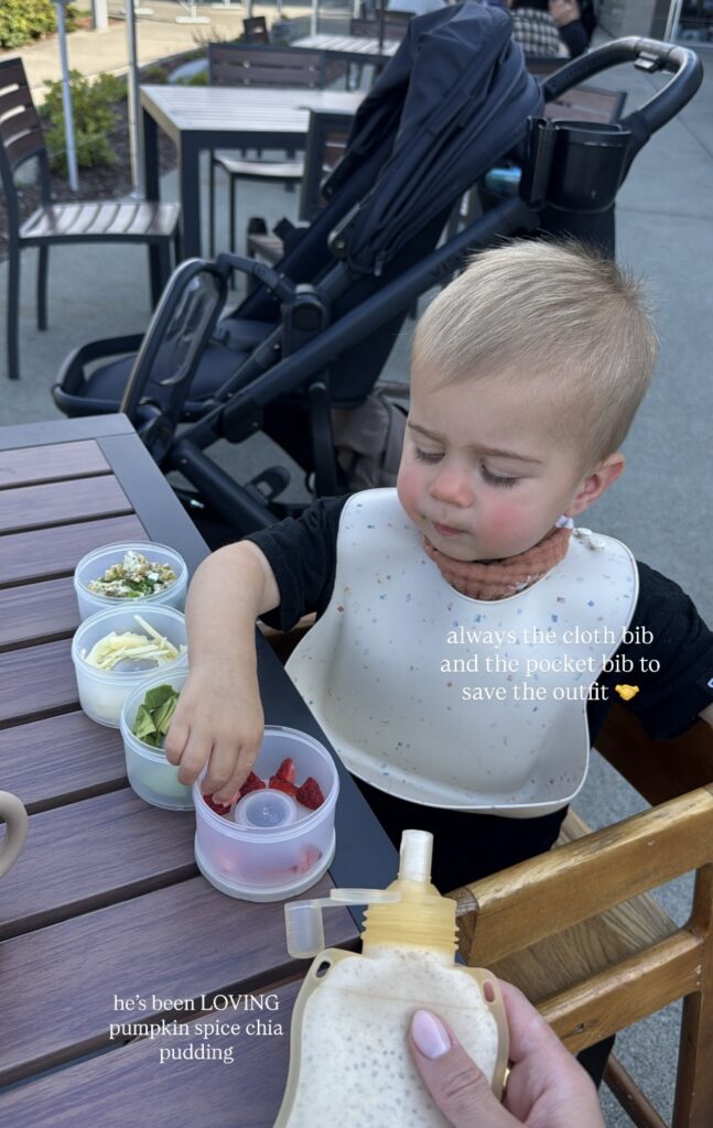 toddler eating healthy snacks on-the-go with easy stackable containers